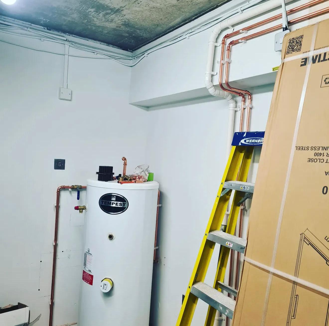 Hot water cylinder and copper pipework installation